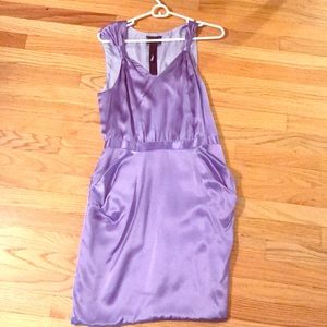 Purple satin dress with pockets.